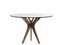 Обеденный стол в эко-стиле Roche Bobois Aster Pedestal Table